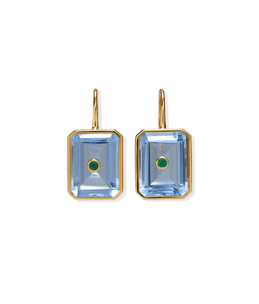 The Tile Earrings by Lizzie Fortunato feature gold-plated brass with rectangular blue gemstones and a central semiprecious rhodolite accent.