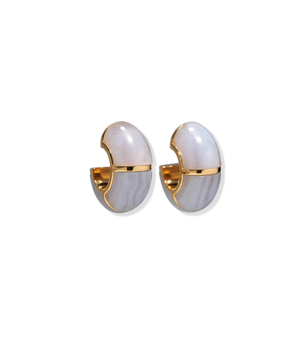 The Zellige Hoops by Lizzie Fortunato are handcrafted gold earrings with a glossy white and grey marbled outer coating, inspired by Moroccan designs, shown on a white background.