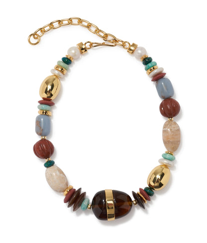 The Kona Collar by Lizzie Fortunato features natural stone beads, gold-tone metal accents, and a gold chain clasp—a bold, mixed-medium statement necklace.