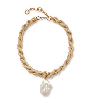 The Woven Collar by Lizzie Fortunato features beige braided leather, gold-tone metal hardware, and a large irregular freshwater pearl pendant.