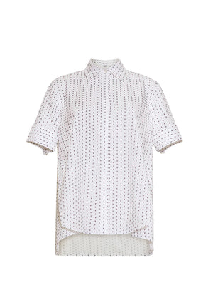 The Trapeze Sashiko Stripe Shirt by Adam Lippes features short sleeves, a collared button-up design, chic stripes, an architectural silhouette, and a slightly longer back hem, all crafted from fine Italian cotton.