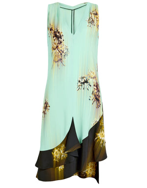The Rhetta Dress by Proenza Schouler is sleeveless and mint green, featuring a V-neck, floral-printed ruffle accents, black and brown details, and a layered asymmetrical hem in soft Printed Viscose Cady.