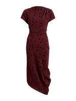 The Proenza Schouler Ren Printed Dot Dress is a burgundy midi dress with black polka dots, short sleeves, a stretch viscose fabric, draped asymmetrical skirt, and a gathered waist.