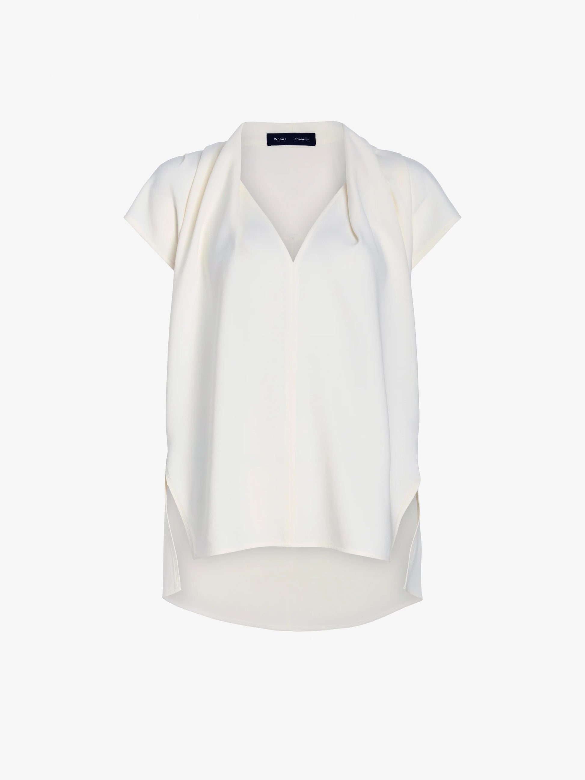 The Ranli Top by Proenza Schouler is a white short-sleeve style with a V-neck and a relaxed fit, expertly crafted from Matte Double Crepe for a luxurious feel. It features a draped collar, high-low hem, and soft draping on a plain background.