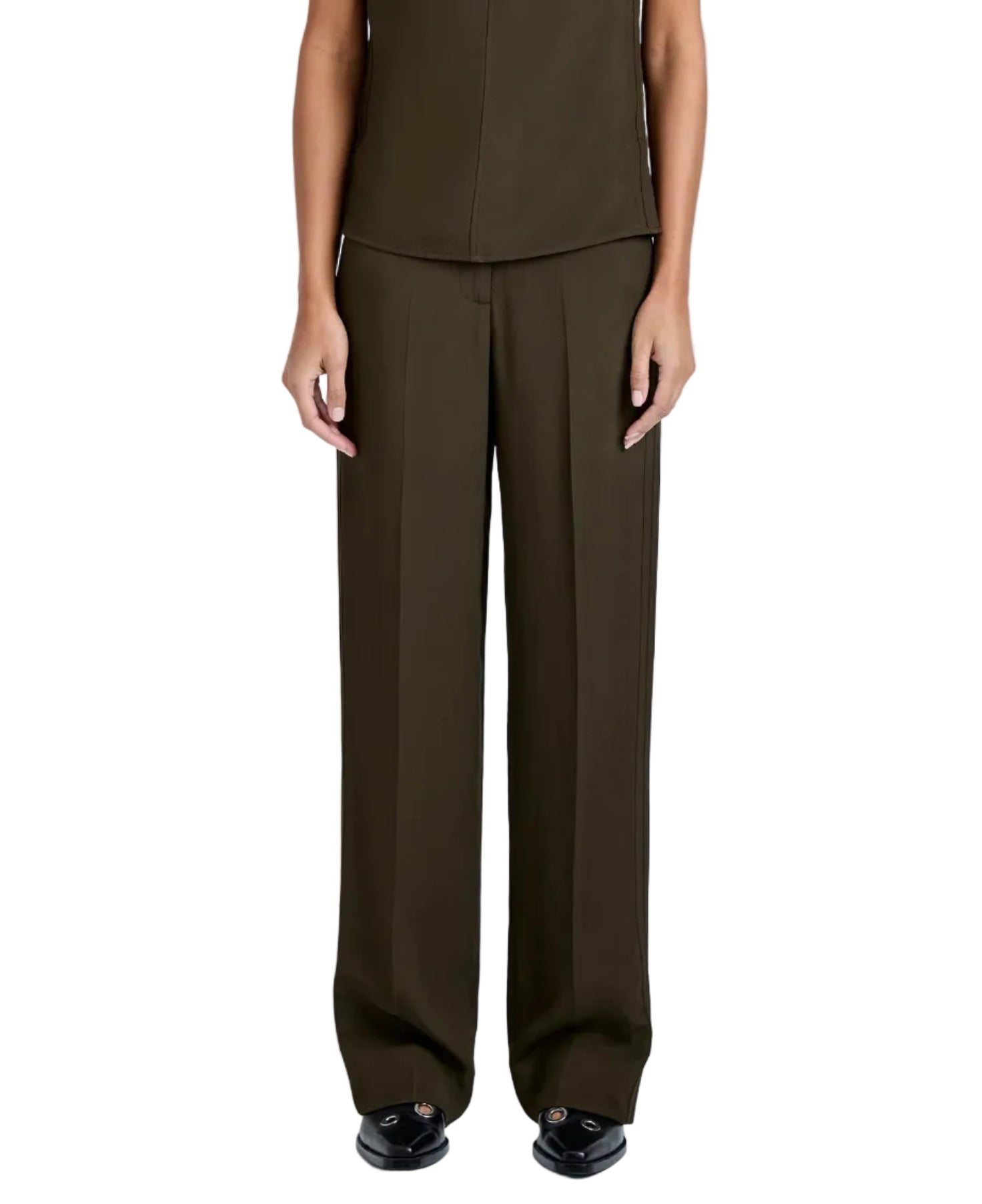 A person wears the Proenza Schouler Lien Pant in dark olive Eco Hammered Viscose, styled high-waisted and wide-leg, with black shoes. Arms are relaxed at their sides and the view is from the waist down.