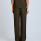 A person faces away from the camera, wearing the Proenza Schouler Lien Pant in high-waist olive green with a matching sleeveless Eco Hammered Viscose top, set against a plain light background.