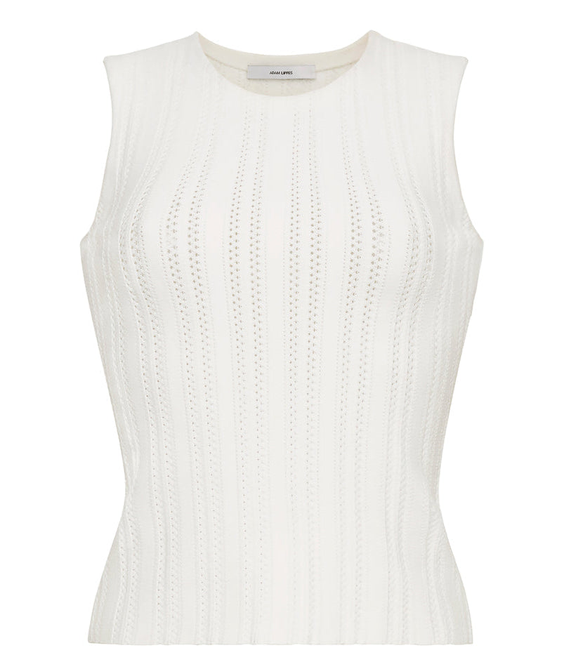 The Brynn Compact Jacquard Knit Top by Adam Lippes is a sleeveless white piece featuring a round neckline, rib-stitch jacquard construction, vertical textured patterns, and a fitted silhouette.