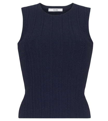 The Brynn Compact Jacquard Knit Top by Adam Lippes is a sleeveless navy shell with a crew neckline, fitted bodice, and subtle vertical rib-stitch jacquard texture.