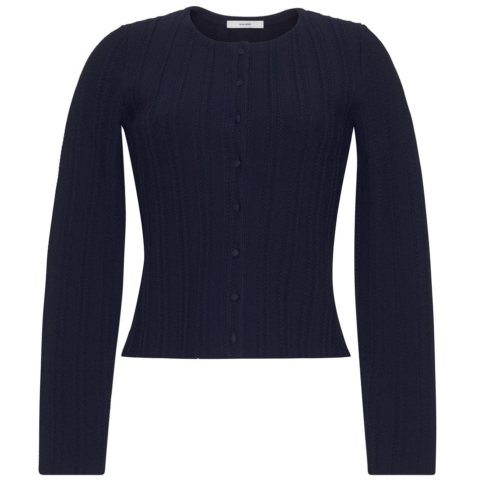 The Faye Compact Jacquard Knit Cardigan by Adam Lippes is a long-sleeve, navy blue cardigan with a round neckline and front buttons, showcasing elegant ribbed knit inspired by classic pointelle designs.