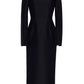 The Adam Lippes Talitha Silk Wool Twill Dress is a knee-length, long-sleeved black sheath with a fitted waist and high boat neckline, shown on a plain white background.