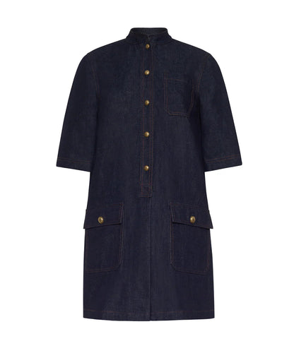 The Lauder Dress by Adam Lippes is a dark Japanese indigo denim, knee-length dress featuring short sleeves, topstitching accents, front buttons, a chest pocket, and two large front flap pockets with antique matte gold closures.