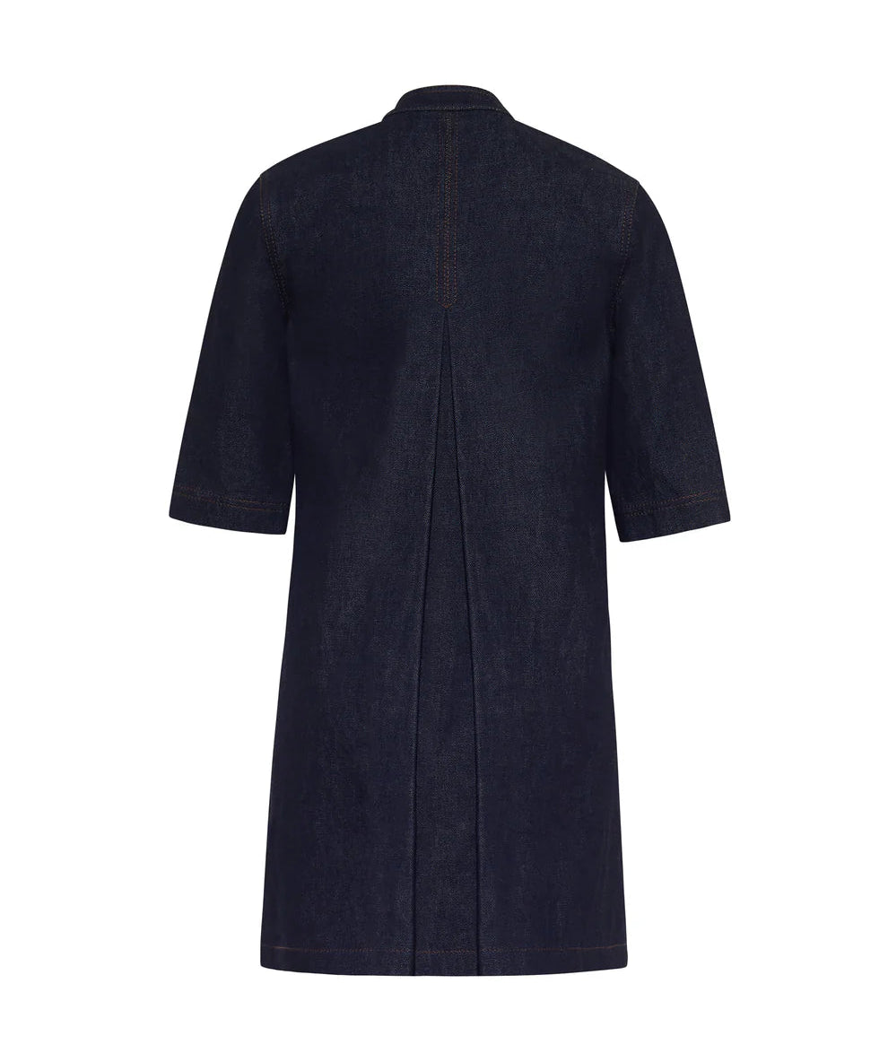 The Lauder Dress by Adam Lippes is a dark blue, knee-length denim dress in Japanese indigo with short sleeves, a central back pleat, and subtle topstitching.
