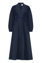 Lela Rose Macrame Lace Detail Dress in navy blue cotton poplin, featuring long sleeves, a V-neckline, floral lace applique on the bodice, and an A-line silhouette.