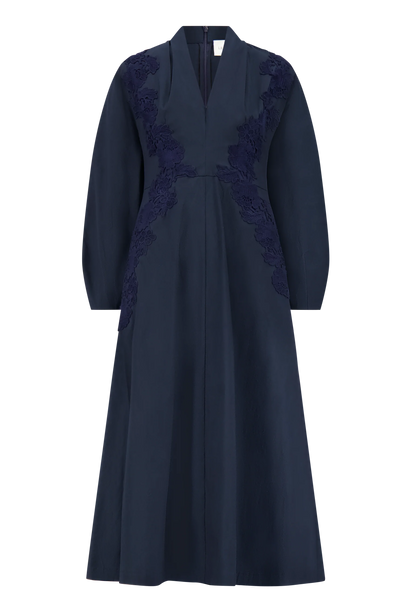 Lela Rose Macrame Lace Detail Dress in navy blue cotton poplin, featuring long sleeves, a V-neckline, floral lace applique on the bodice, and an A-line silhouette.