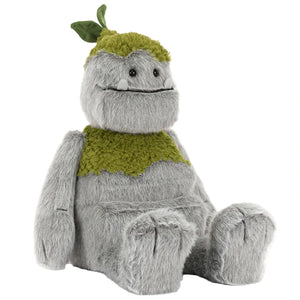 Rockleton by Jellycat is a gray plush toy with green patches, a leafy detail on its head, a big smiling face, and floppy arms. It sits upright against a white background.