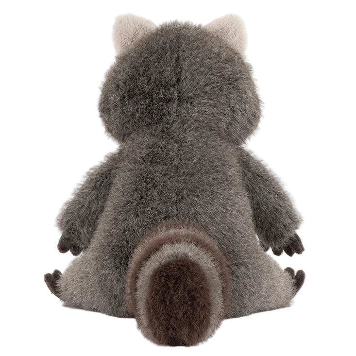 The Trixiwoo Raccoon by Jellycat is a plush toy raccoon with gray and brown fur, a striped tail, and pointed ears, shown from the back.