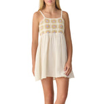 A teen girl models the Rylee & Cru Crochet Sundress, featuring a sleeveless, short cream design with a patterned bodice and thin straps, standing against a white background.