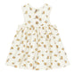 The Rylee & Cru Baby Girls' and Girls' Layla Dress is a sleeveless cream babydoll dress with yellow and brown fruit print, three back buttons, and a gathered skirt, made from soft cotton jersey.