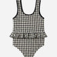 The Rylee & Cru Baby Girls' Skirted One-Piece features a black and white checkered pattern, a scoop neckline, UPF 50+ sun protection, and an adorable ruffled waistline detail. Shown laid flat on a white background—it's the perfect swimsuit for your little one's next pool day.
