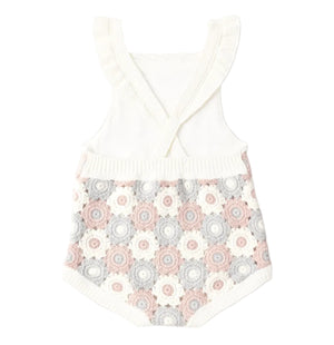 The Baby Girls' Crochet Romper by Rylee & Cru features ruffle straps and a pastel crocheted floral pattern on the back, offering vintage-inspired charm.