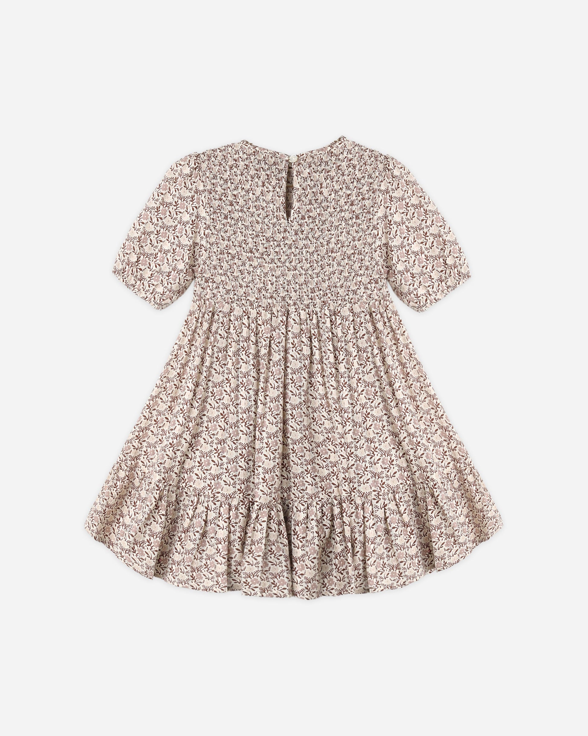 A Girls’ India Dress by Rylee & Cru, featuring short sleeves, a knee-length floral design, a smocked bodice, gathered skirt, and back button closure, is displayed flat on a white background.