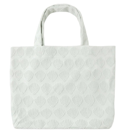 Light-colored Rylee & Cru Beach Bag with a textured scallop shell pattern and two handles, displayed against a white background—an ideal everyday accessory.
