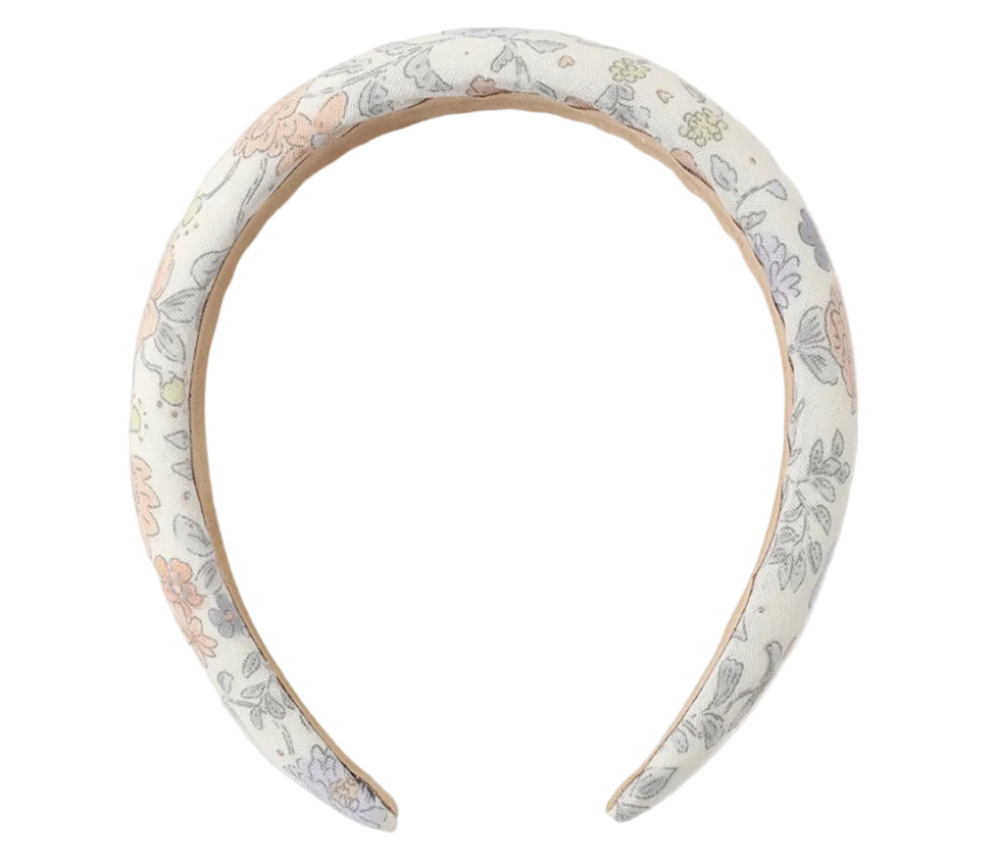 The Girls' Padded Headband from Rylee & Cru features a white fabric with a pastel floral and leaf pattern, making it the perfect playful summer accessory for any outfit.