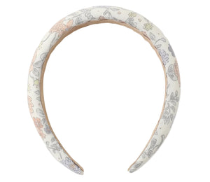 The Girls' Padded Headband from Rylee & Cru features a white fabric with a pastel floral and leaf pattern, making it the perfect playful summer accessory for any outfit.