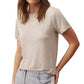 Woman wearing a gray short-sleeved TWP His Tee made from the softest jersey fabric and light blue jeans.