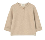 The Cozmo Baby Boys’ Remo Knit Sweater is a beige long-sleeve top for toddlers, crafted from soft fabric with rolled cuffs, a round neckline featuring a single button, and a small label at the bottom hem—making it a cozy choice for cooler days.