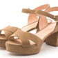 A pair of beige suede Rupert Sanderson Deidre Platform Sandals with chunky heels and crisscross straps, featuring an ankle buckle closure.