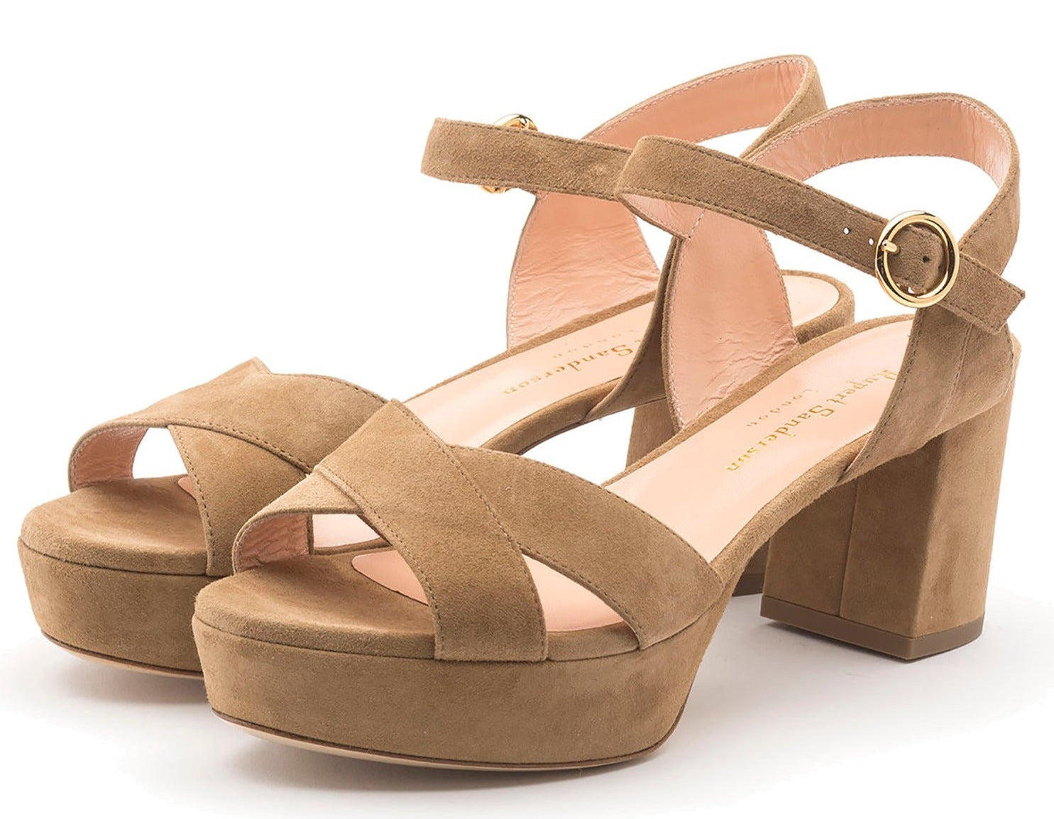 A pair of beige suede Rupert Sanderson Deidre Platform Sandals with chunky heels and crisscross straps, featuring an ankle buckle closure.