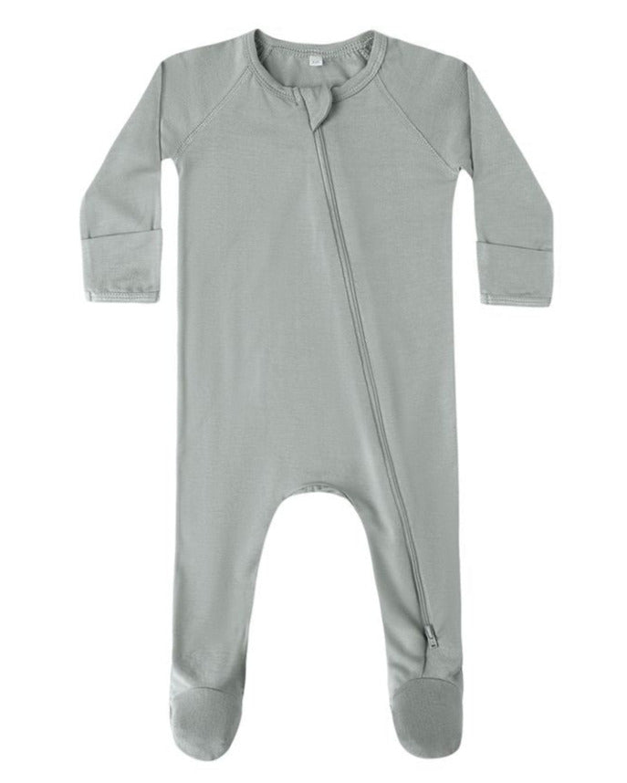 The Quincy Mae Baby Bamboo Zip Footie is a light gray, long-sleeve onesie with covered feet and an asymmetrical zipper from neck to left leg.