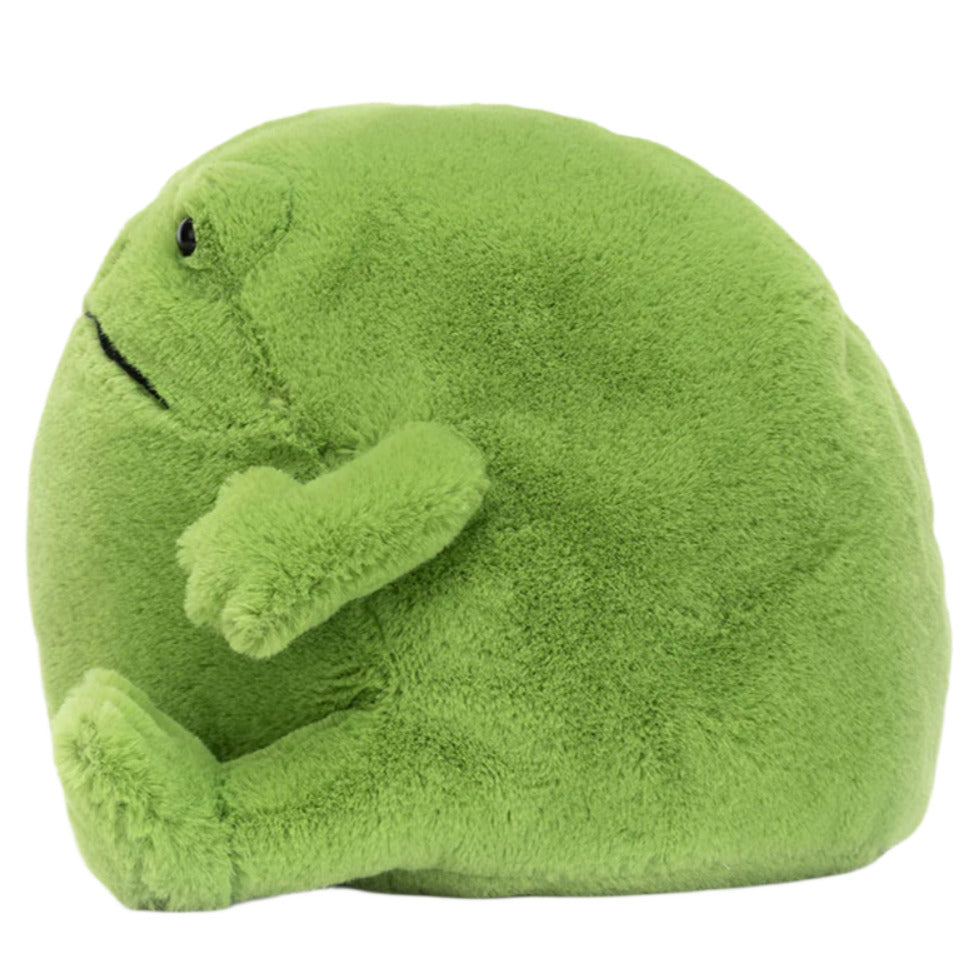 Ricky Rain Frog by Jellycat is a round, green plush toy with short arms and legs, sitting upright and facing left—perfect for cozy cuddles.