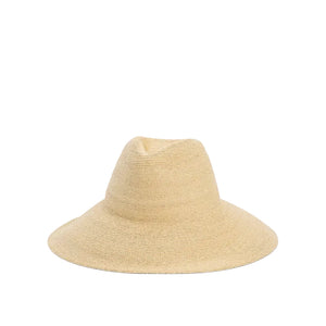 The Janessa Leone Colette Hat is a wide-brim raffia straw hat with a gently indented crown, providing excellent sun coverage. Shown against a plain white background.