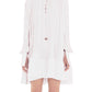 A model is showcasing the Lanvin Flared Pleated Dress with Long Sleeves, a white crepe de Chine dress featuring an elegant keyhole neckline, slightly flared hem, and extended sleeve cuffs that partially cover the hands.