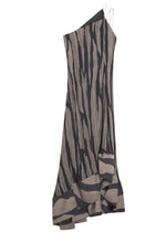 Lanvin's Asymmetrical Cascade-Effect Dress features a one-shoulder design with vertical black and beige stripes, accented by a single metal chain strap and a flowing hemline.