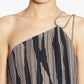 Model wears the Lanvin Asymmetrical Cascade-Effect Dress, featuring a pleated zebra print and a delicate chain strap, shown from shoulders to mid-chest.