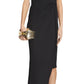 A woman wears the Lanvin Asymmetrical Long Pleated Dress, styled with a gold clutch and gold bow-accented pointed-toe heels—an elegant look ideal for sophisticated occasions.