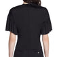 A woman is seen from the back wearing the Lanvin Summer Top with Eyelet Detail, a short-sleeved black blouse paired with matching black trousers.
