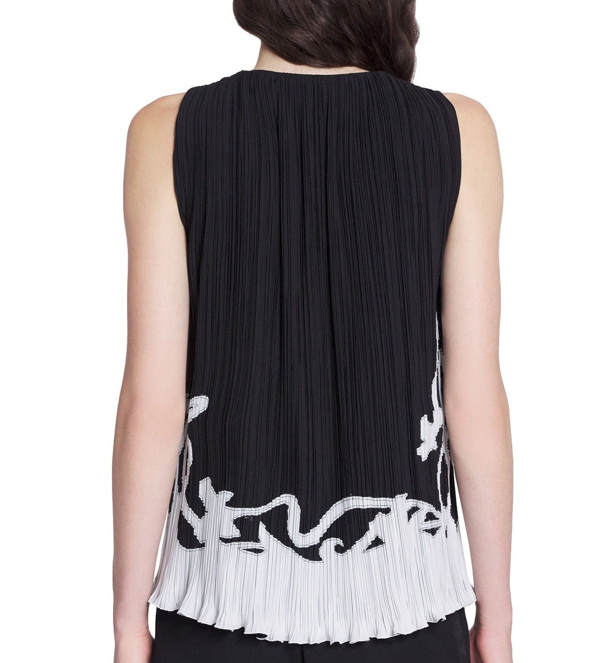 Rear view of a woman wearing a Lanvin Sleeveless Pleated Top made in Spain with vertical pleats and white floral embroidery along the hem.