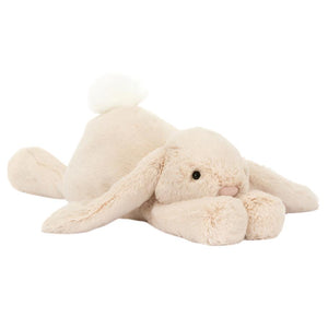 The Jellycat Smudge Rabbit, Big by Jellycat features a soft, oatmeal-fur plush design with a fluffy tail and long lop ears.