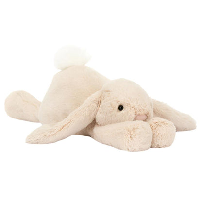 The Jellycat Smudge Rabbit, Big by Jellycat features a soft, oatmeal-fur plush design with a fluffy tail and long lop ears.