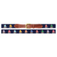 The Rainbow Fleet Belt by Smathers & Branson features a navy backdrop adorned with hand-stitched, colorful sailboats in a repeating needlepoint pattern, complemented by brown Italian leather accents and finished with a gold buckle.