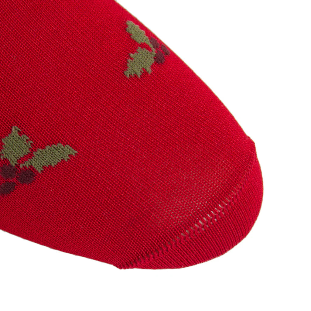 Close-up of the toe area of a Dapper Classics Red with Burgundy Berry and Pine Green Holly Wool Sock Linked-Toe Mid-Calf, featuring a festive holly pattern and crafted from breathable wool.