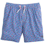 The Johnnie-O Red Fin Blue Fin Swim Shorts boast a vibrant red and blue geometric pattern complemented by a white drawstring, making them ideal for those who enjoy lively prints.