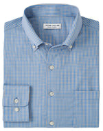 A neatly folded Peter Millar Barrie Performance Twill Sport Shirt in blue checkered pattern, featuring UPF 50+ sun protection and a white label inside the collar.