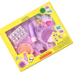Yellow box labeled “Super Smalls” Strawberry Sweetheart Beauty Play Kit with purple and pink kid-safe makeup items, nail stickers, and gem accessories displayed inside for fun pretend play.