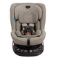 The Nuna Revv Carseat by Nuna is a gray child car seat featuring a five-point harness, adjustable headrest, and side impact protection, all mounted on a black base.