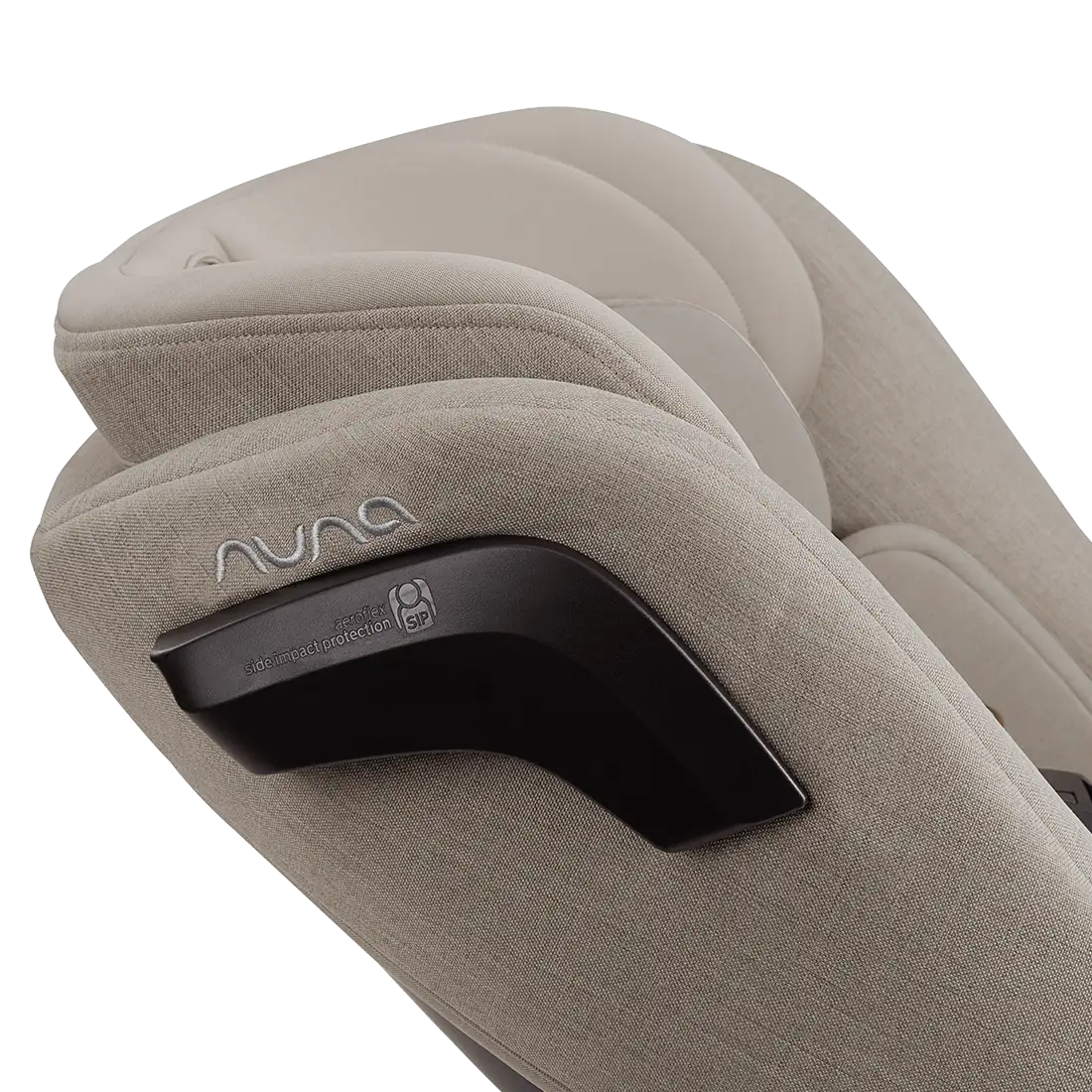 Close-up of the backrest of a Nuna Revv Carseat, showcasing the Nuna brand logo and part of the car seat's structure in beige fabric.